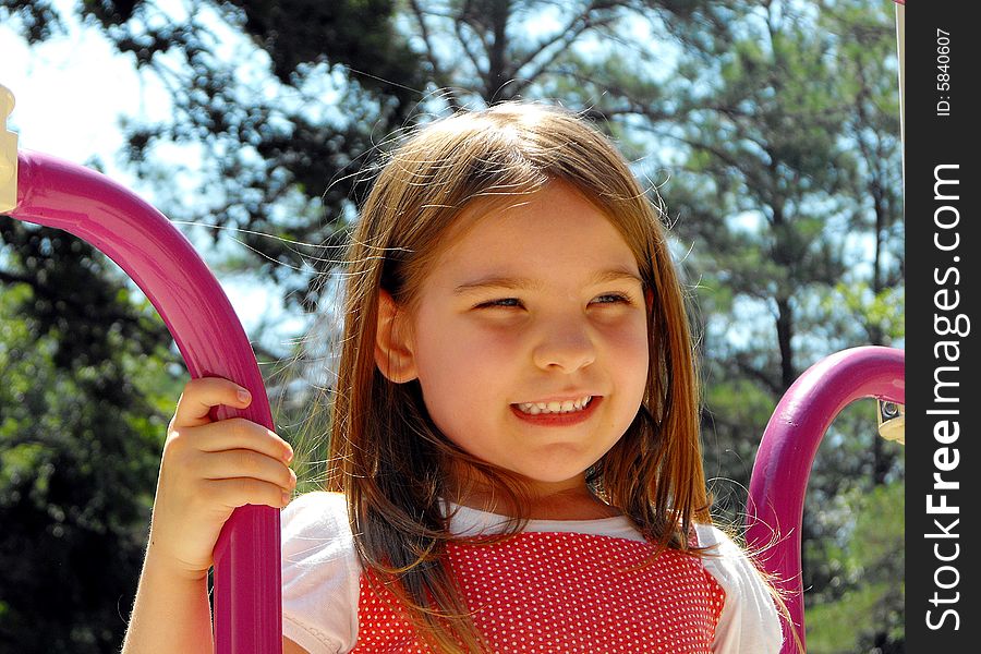 Cute little girl enjoying the playground. Cute little girl enjoying the playground