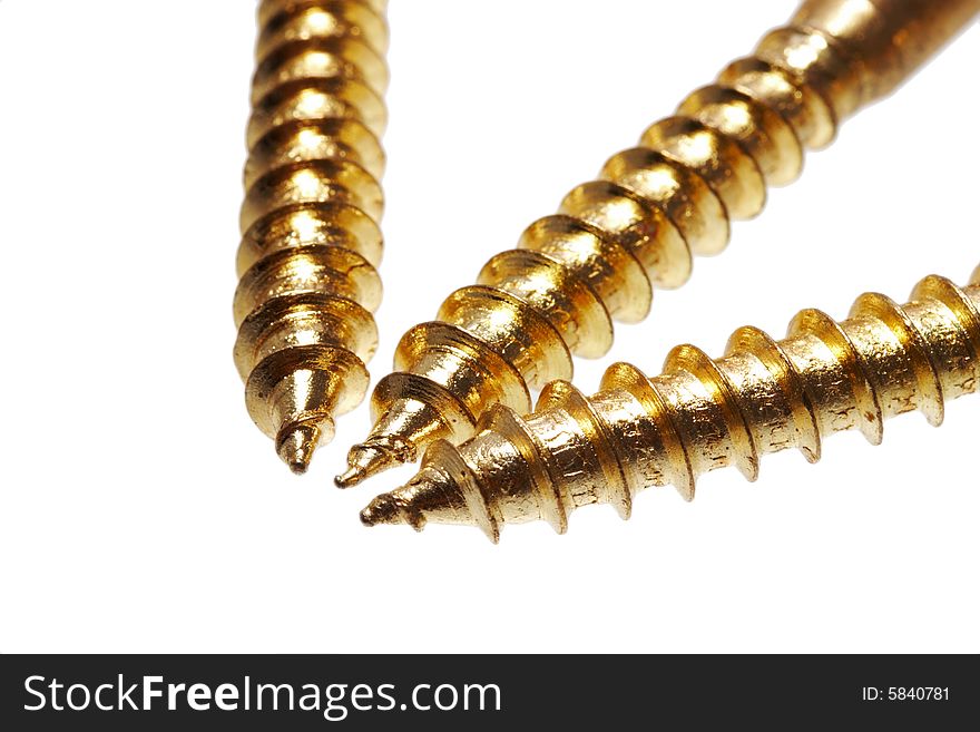 Golden screws on white background