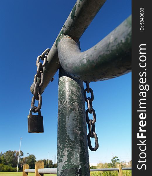 Chain and padlock on iron gate