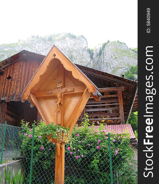 A tiny chapel among the treescrucifix in the dolomites. A tiny chapel among the treescrucifix in the dolomites