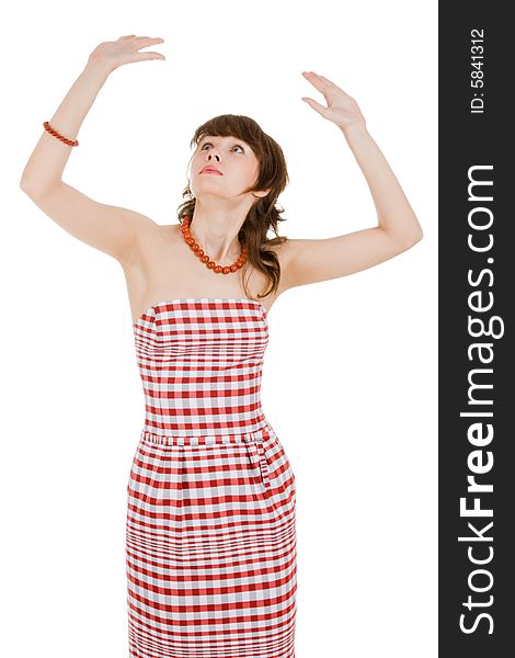 Pretty woman in the chequered dress with doll gestures standing and looking upward. Pretty woman in the chequered dress with doll gestures standing and looking upward