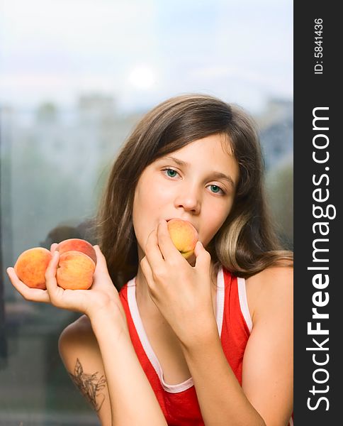 Beauty girl eating fruit for your design