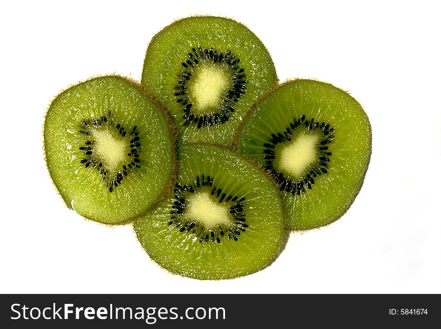 Four kiwi fruit slices on white background. Four kiwi fruit slices on white background