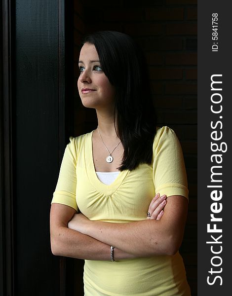 Pretty teen in yellow in natural light