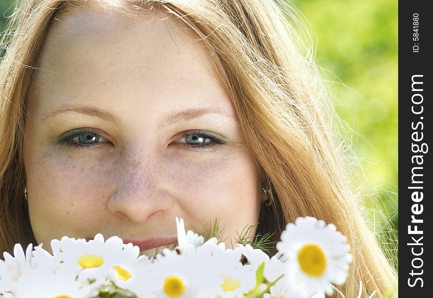 Portrait of beautiful smiling girl with daisies. Portrait of beautiful smiling girl with daisies