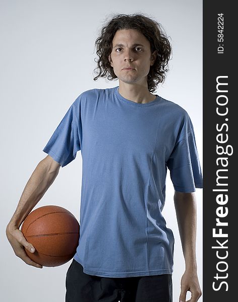 Man Holding Basketball - Vertical