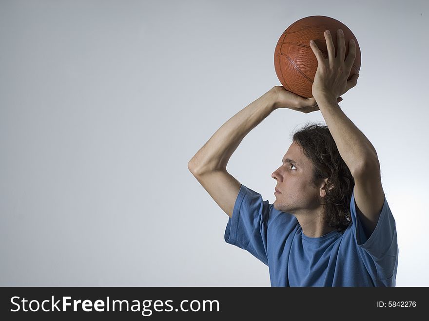 Man shooting a basketball. Horizontally framed photograph. Man shooting a basketball. Horizontally framed photograph