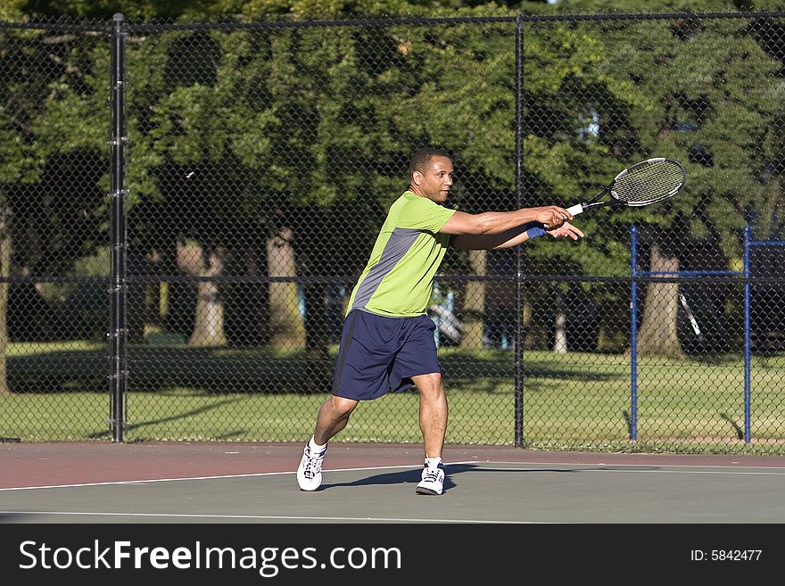 Man On Tennis Court Playing Tennis