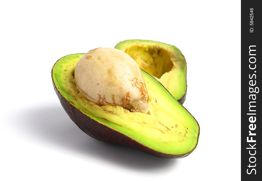 Avocado cut in the middle on white background