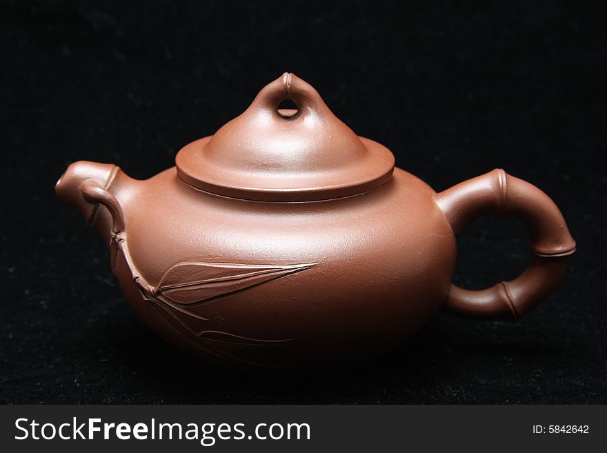 My teapot isolated on black background,also called zisha teapot in China.