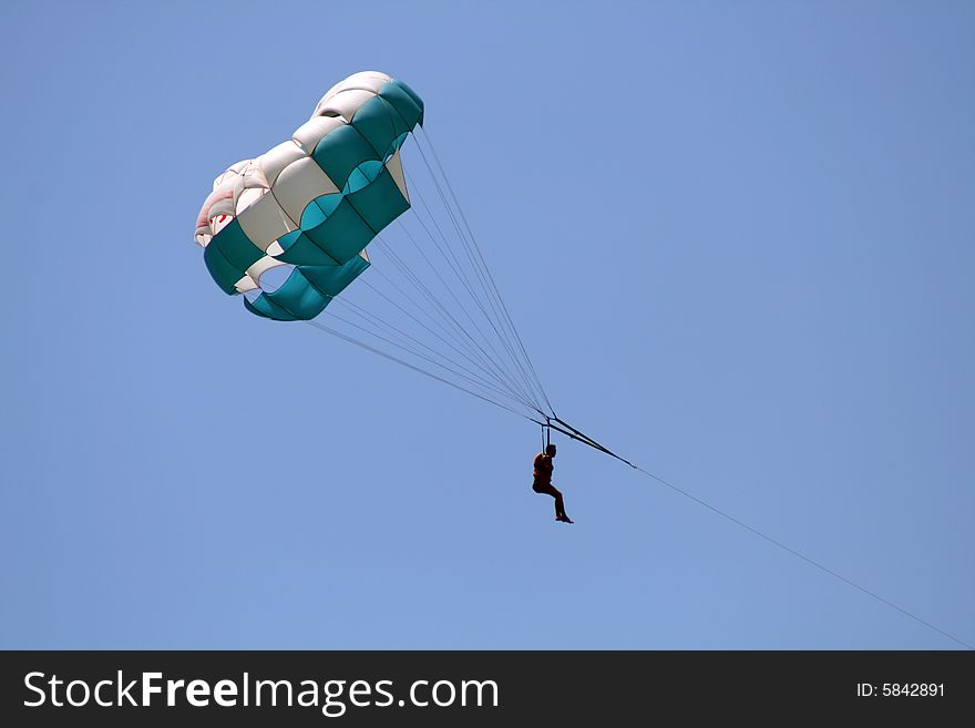 Flying parachute on background with blue sky. Flying parachute on background with blue sky