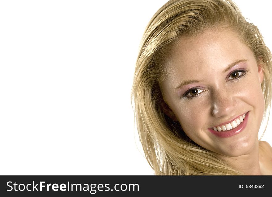 A portrait of a beautiful blond smiling Caucasian young girl (15-24) on white background. A portrait of a beautiful blond smiling Caucasian young girl (15-24) on white background