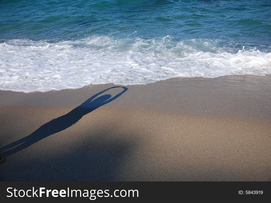 Womanish shade is on a beach