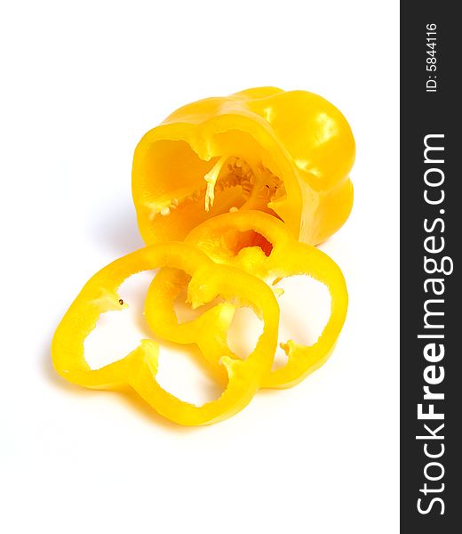 Sliced yellow pepper on white background