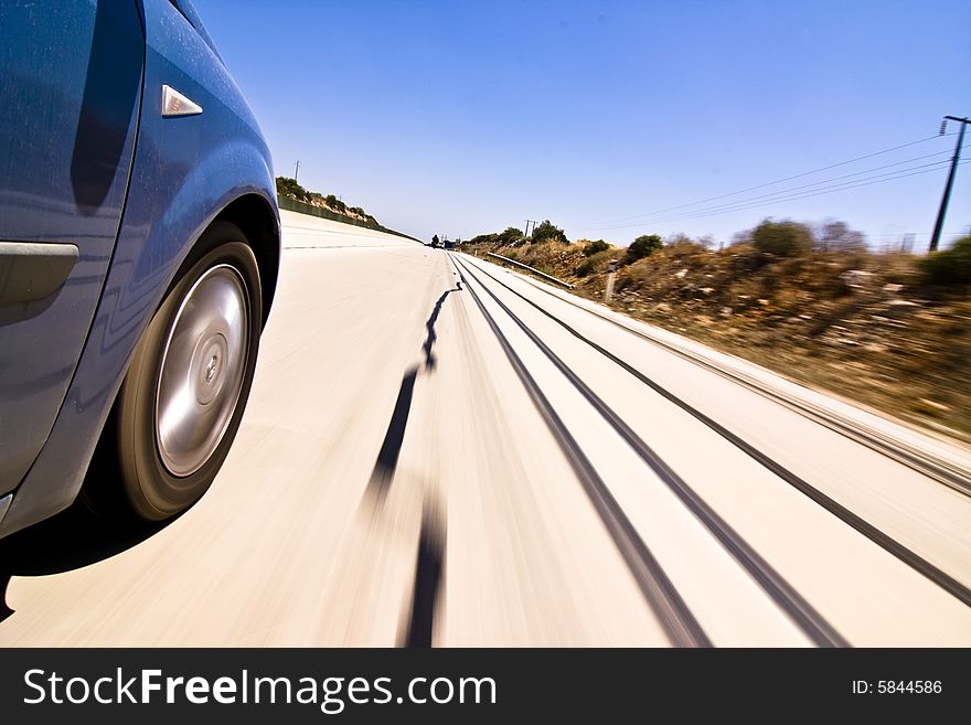 Blue car at high speed on the road. Blue car at high speed on the road