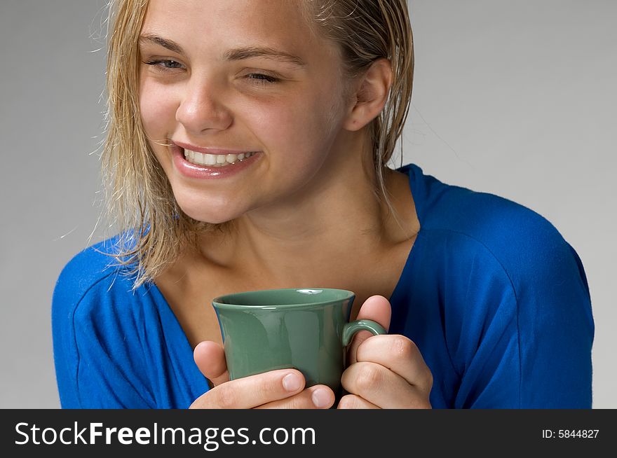 Teenager with the green mug. Teenager with the green mug
