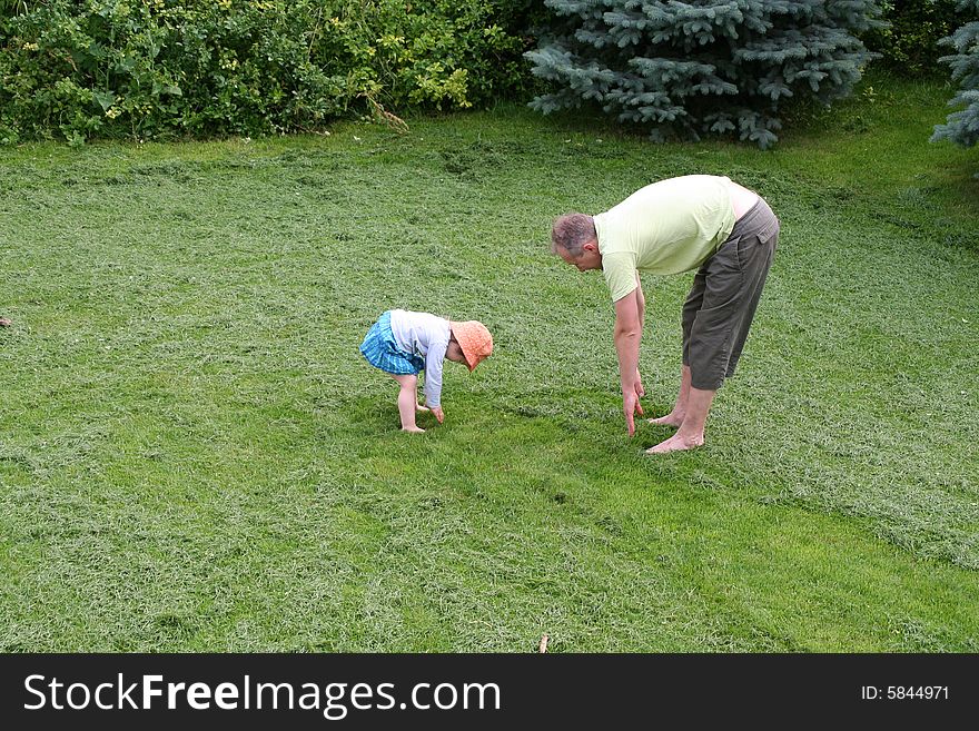 Father and little daughter sporting in the morning outdoor. Father and little daughter sporting in the morning outdoor