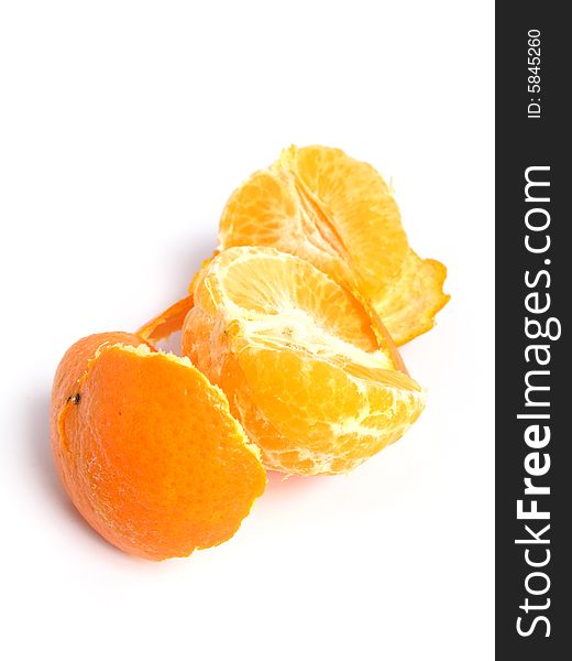 Organic Tangerine peeled and sectioned, on white background