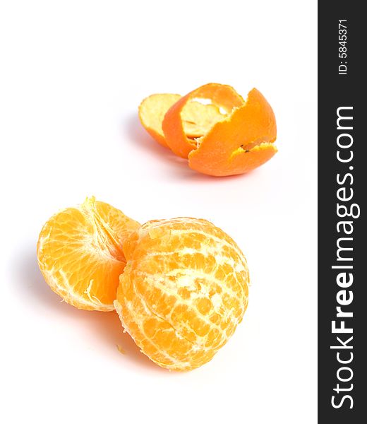 Organic Tangerine peeled and sectioned, on white background