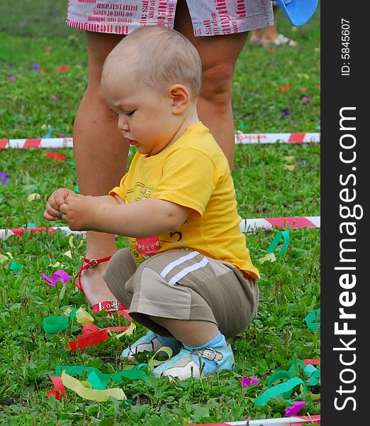 Baby-boy playing in green grass