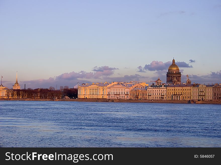 Sunset above Neva river and Isaak cathedral in Saint-Petersburg