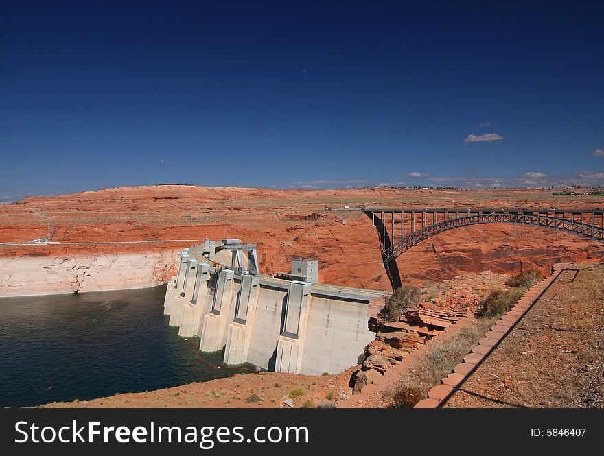 Glen Canyon Dam in Utah with blue skys and bridge. Glen Canyon Dam in Utah with blue skys and bridge