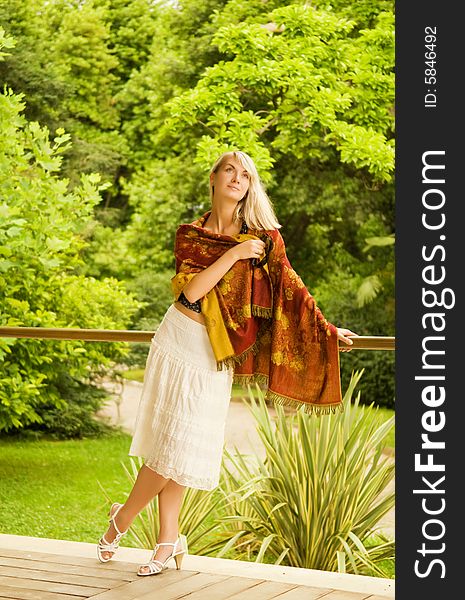 Beautiful young woman relaxing in a park