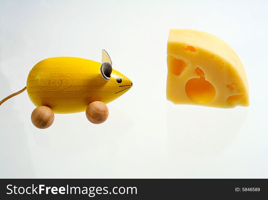 Yellow mouse with yellow cheese. Yellow mouse with yellow cheese