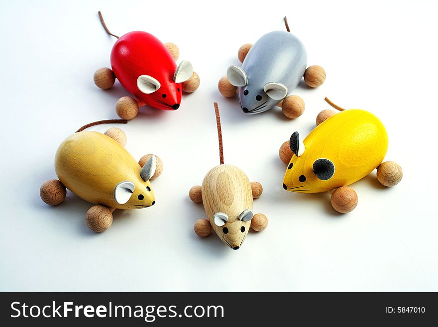 Five coloured wooden mice on white background. Five coloured wooden mice on white background