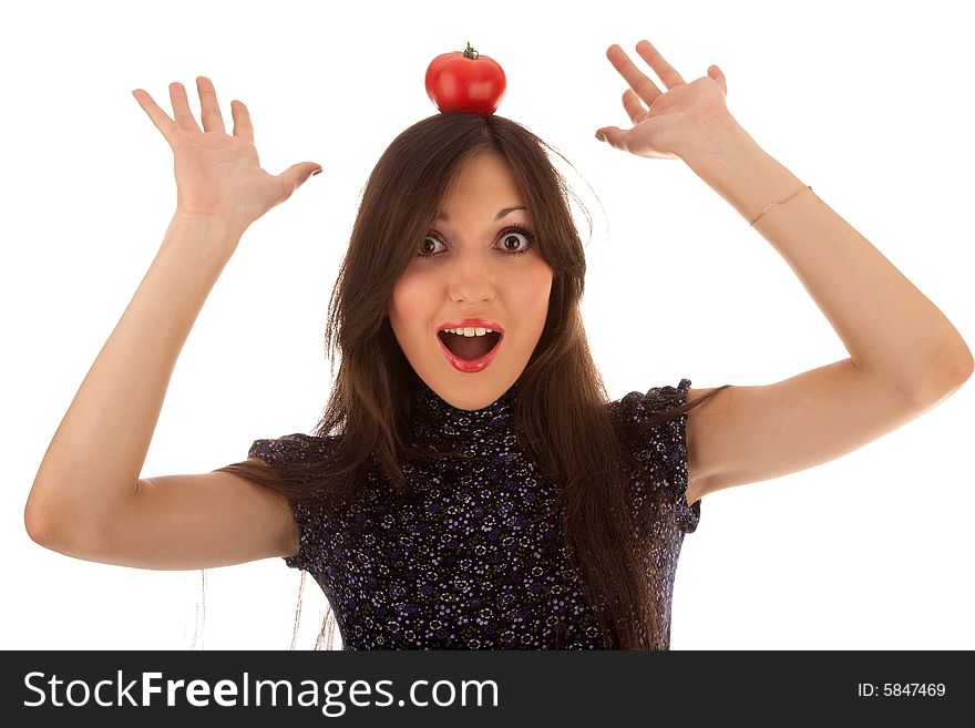 Young beautiful girl with tomato on the white. Young beautiful girl with tomato on the white