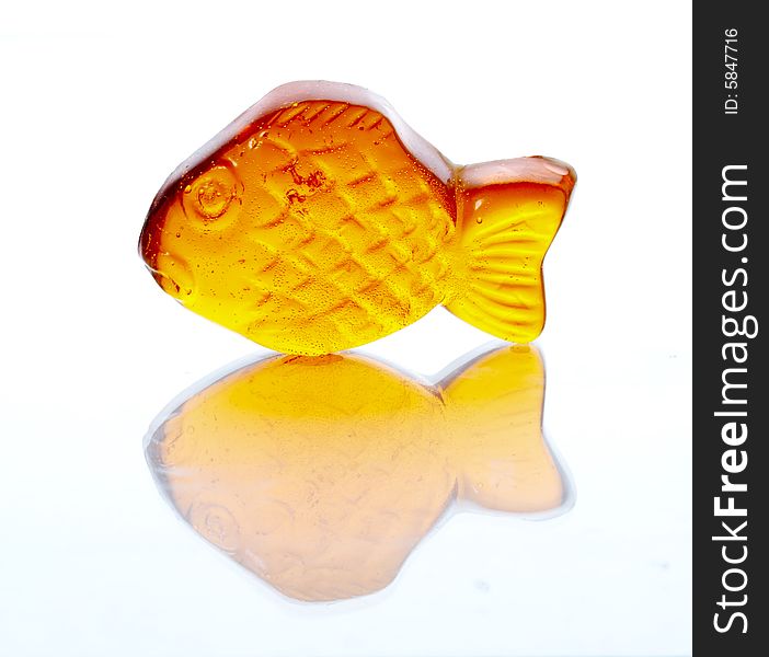 Gold small fish on a white background. Gold small fish on a white background