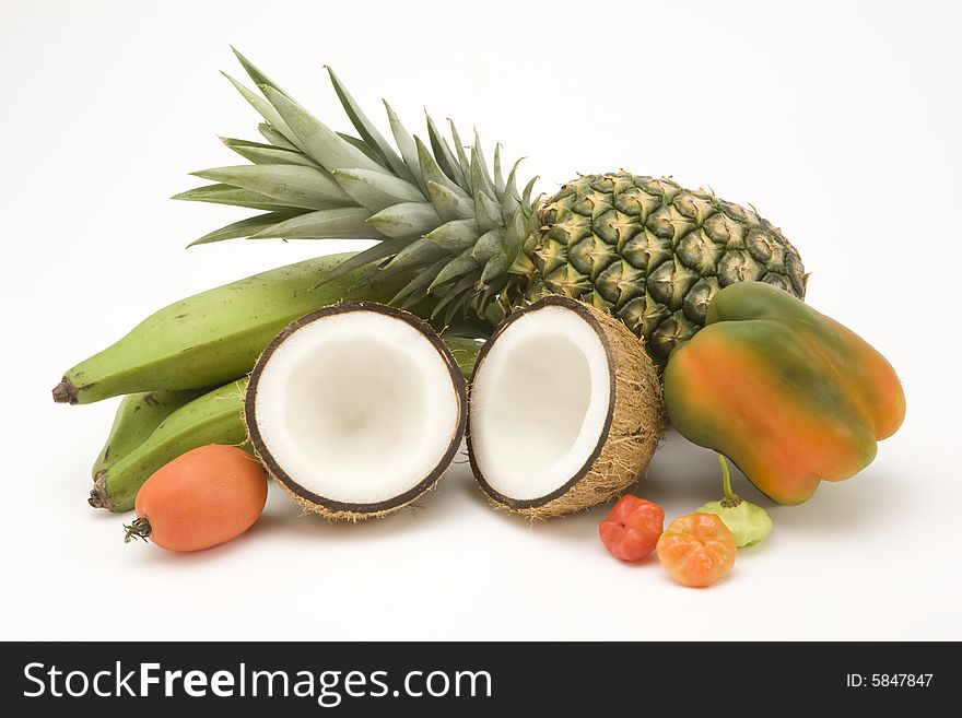 Tropical fruits and vegetables on white seamless paper. Tropical fruits and vegetables on white seamless paper