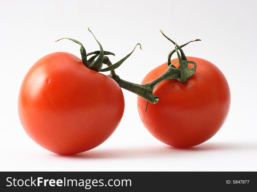 Fresh tomatoes isolated on a white background.