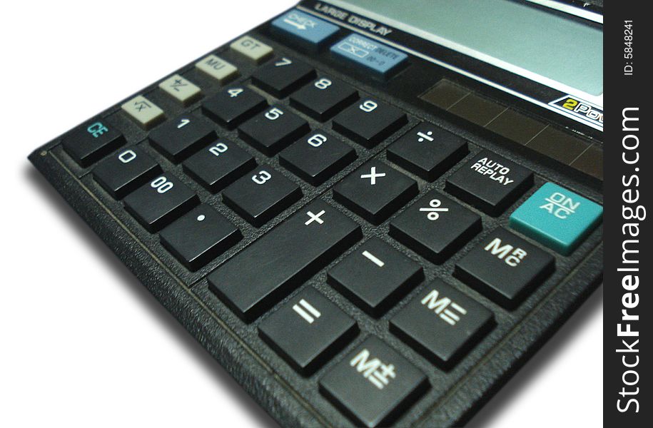 Close-up of a black color calculator on a white background