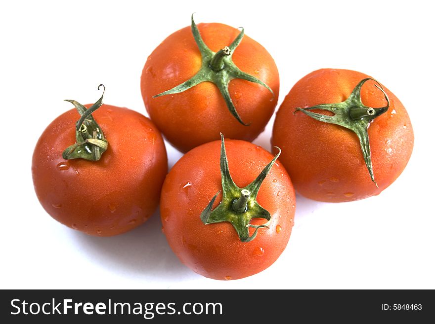 Four tomatoes on white background