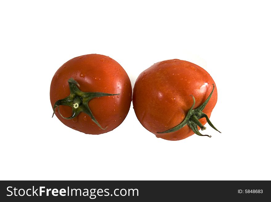 Two tomatoes on white background