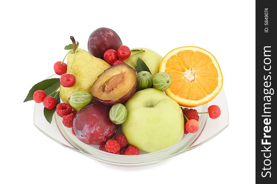 Fruit and berries lay on a glass plate. Fruit and berries lay on a glass plate