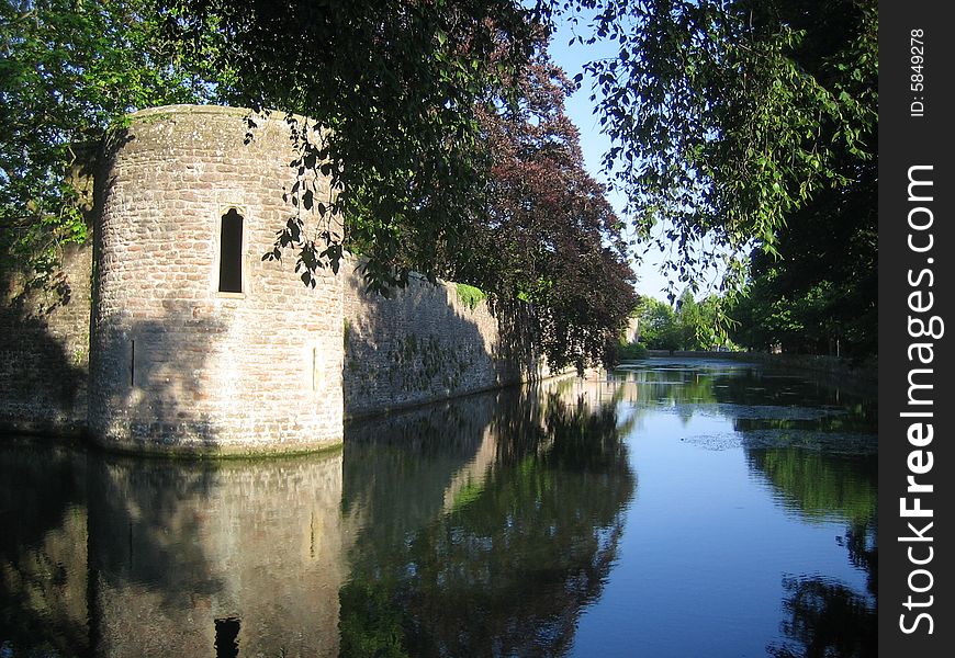 Castle Wall Reflected In Moat