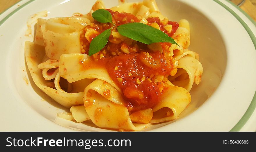 Italian pasta fettuccine with tomatoes sauce. Italian pasta fettuccine with tomatoes sauce