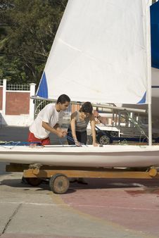 Couple Preparing To Sail - Vertical Stock Photography Couple Preparing To Sail - Vertical Stock Photography