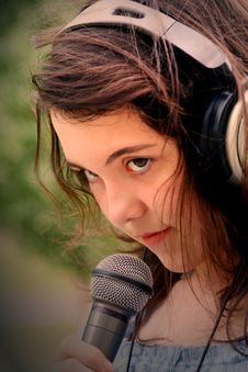 Woman Singing In Microphone Royalty Free Stock Images