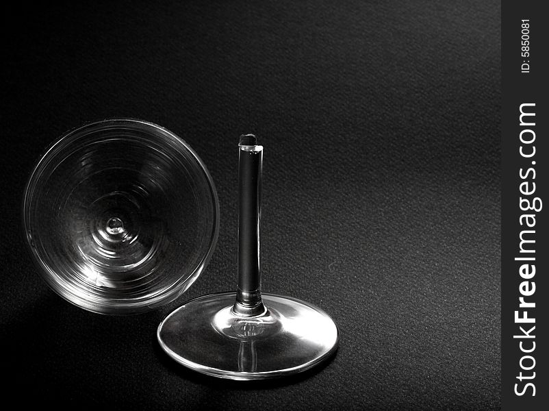 Broken wine-glass on black background