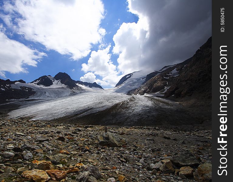 Risky weather in mountain near a big glacier