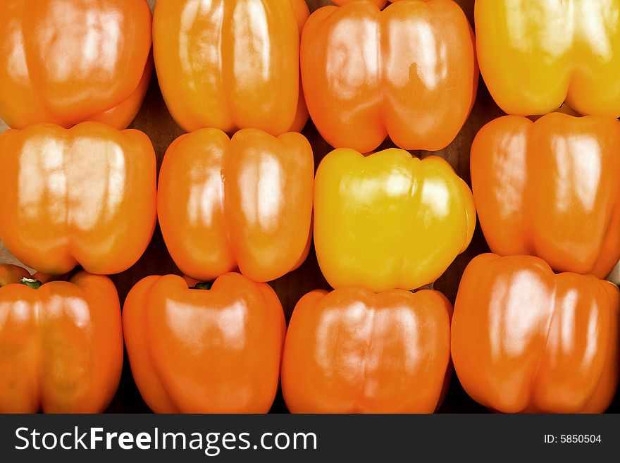 Stacked Bright Red Bell Peppers Filling the Frame