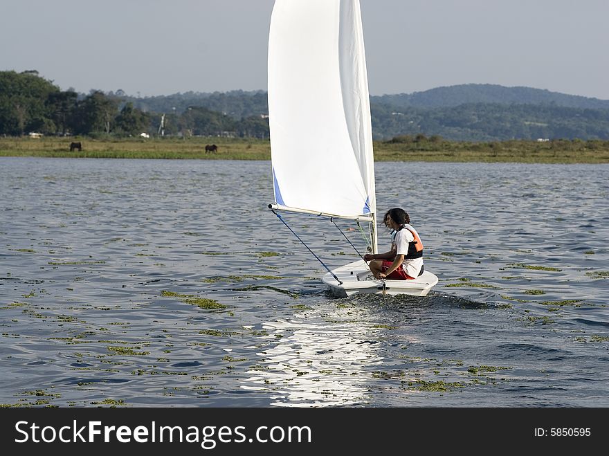 Couple Sailing on Lake - Horizontal