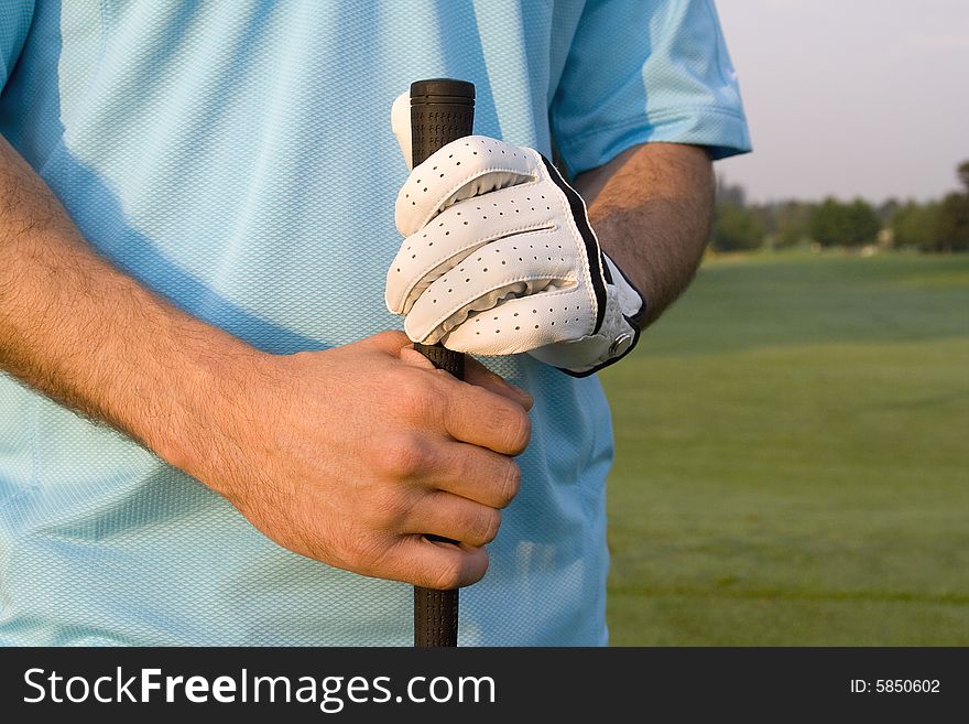Two hands grasping golf club - Horizontally framed photo. Two hands grasping golf club - Horizontally framed photo