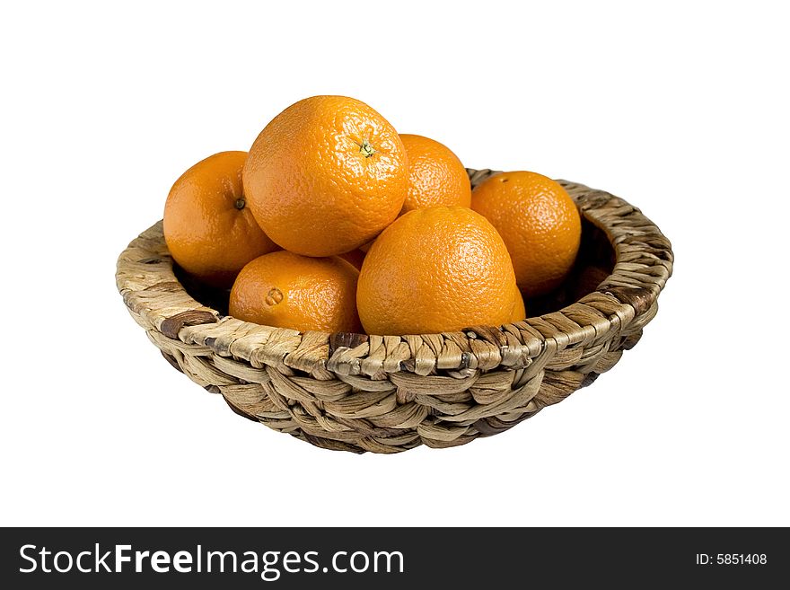 Oranges in basket are isolated on white background