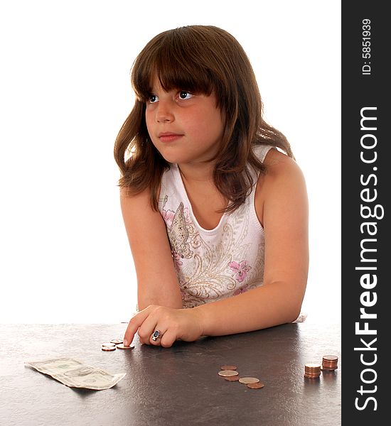 Elementary girl counting her money, wishing she had more for something special. Elementary girl counting her money, wishing she had more for something special.