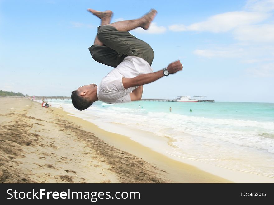 Jumping for exciting tropical beach