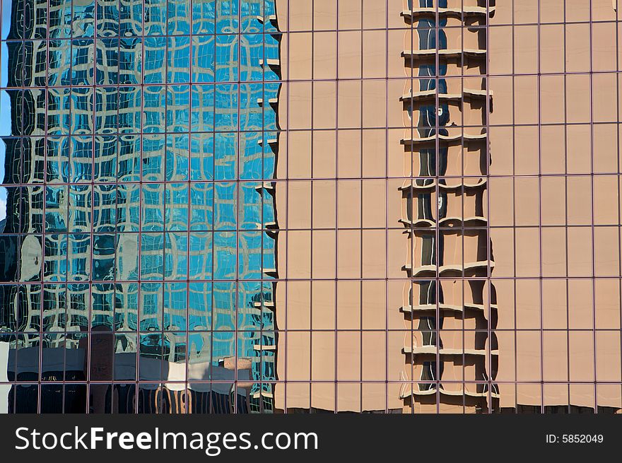 Buildings Reflecting In A Skyscraper